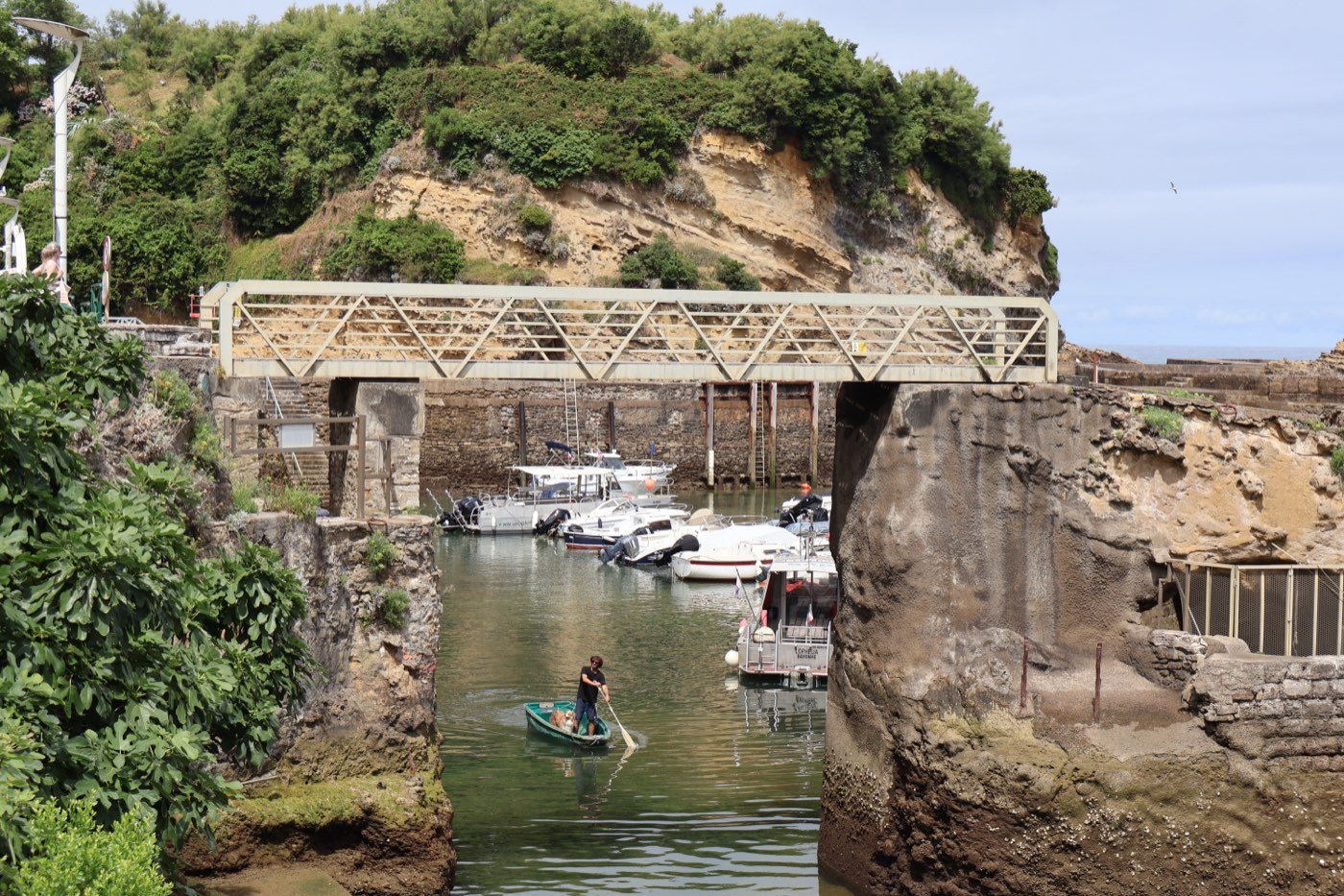 Small fishing harbour on the Basque coast, boats and a rowboat