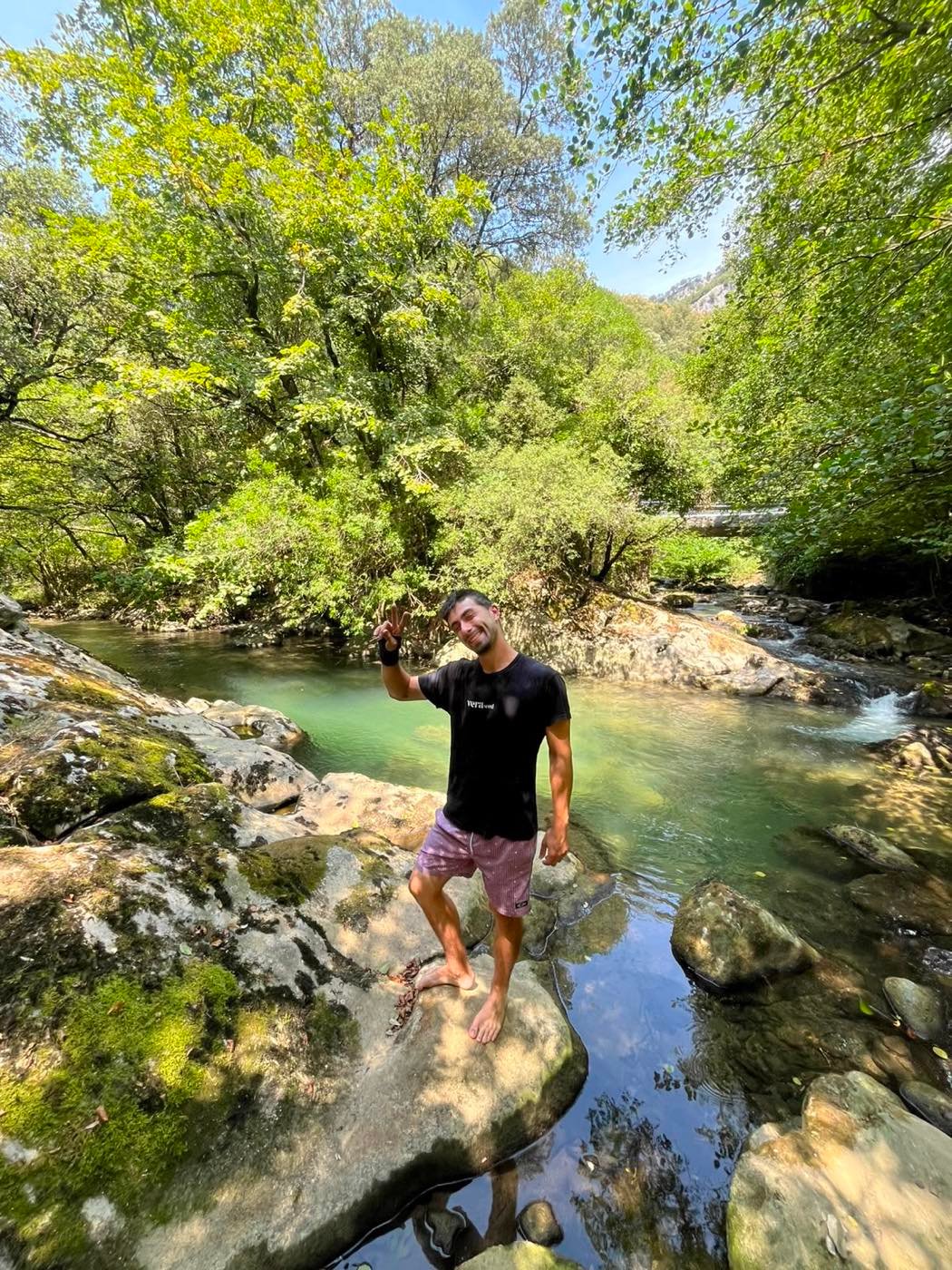 Alex standing in the river in Larraún, mid-afternoon